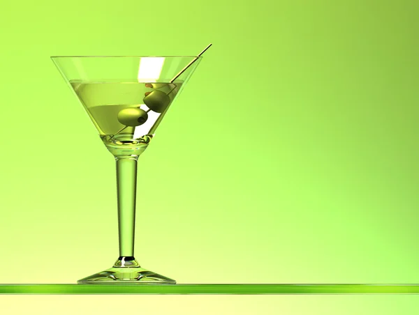 Мартини коктейль с двумя оливками на зеленом фоне — стоковое фото