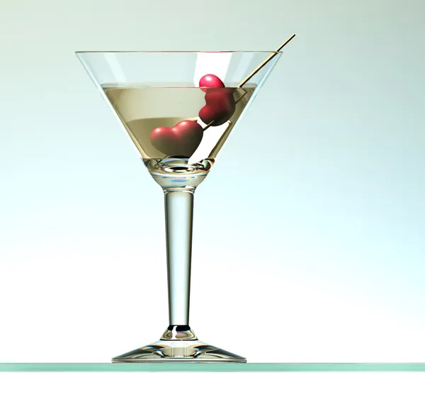 Dos corazones en palo en cóctel de martini sobre fondo claro — Foto de Stock