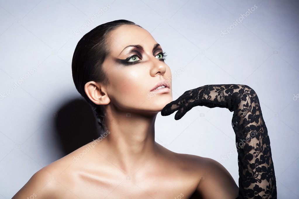 Close up portrait of brunette sexy woman with black glove