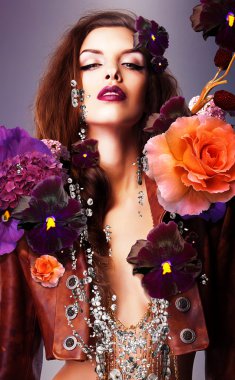 Erotic woman with silver accessory in flowers clipart