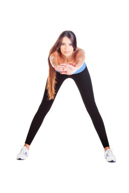 Woman doing forward bending gym exercise clipart