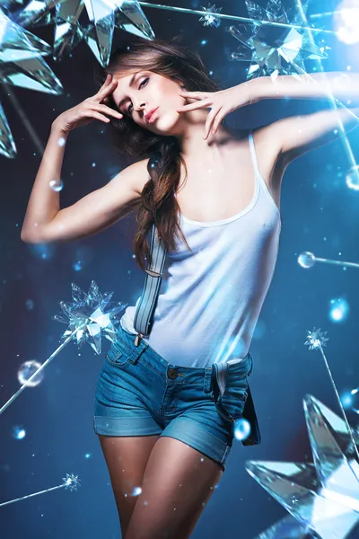 Posing sexy woman in shorts with suspenders and stars — Stock Photo, Image