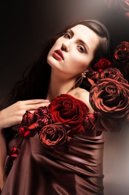 Chocolate colored attractive woman with chocolate roses clipart