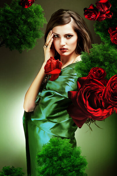 Attractive woman in green fabric with red roses