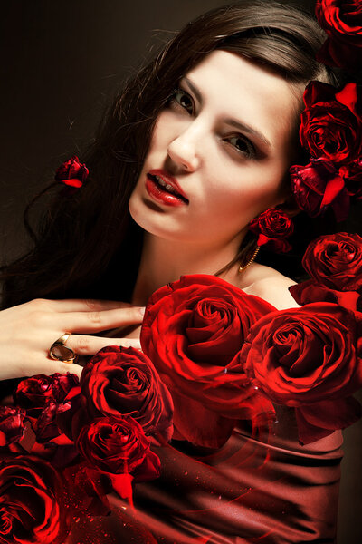 Close-up portrait of woman with red roses