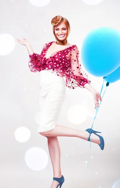 Crazy blond lady in white skirt with blue balloons — Stock Photo, Image