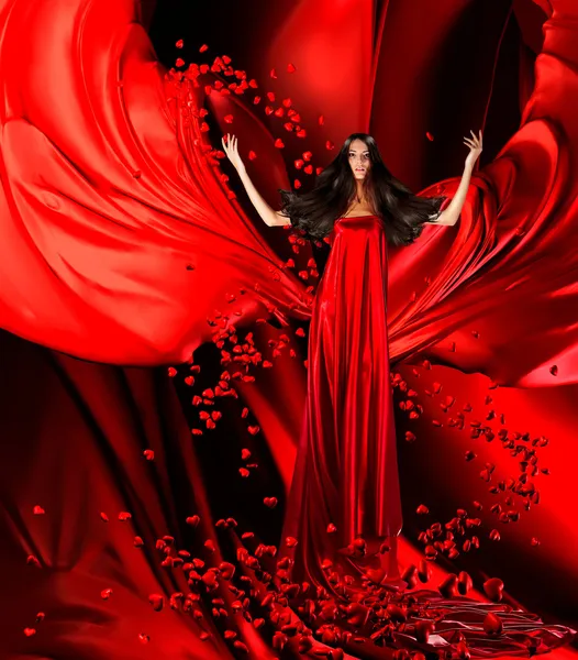 Godin van de liefde in rode jurk met prachtige haren en harten op — Stockfoto
