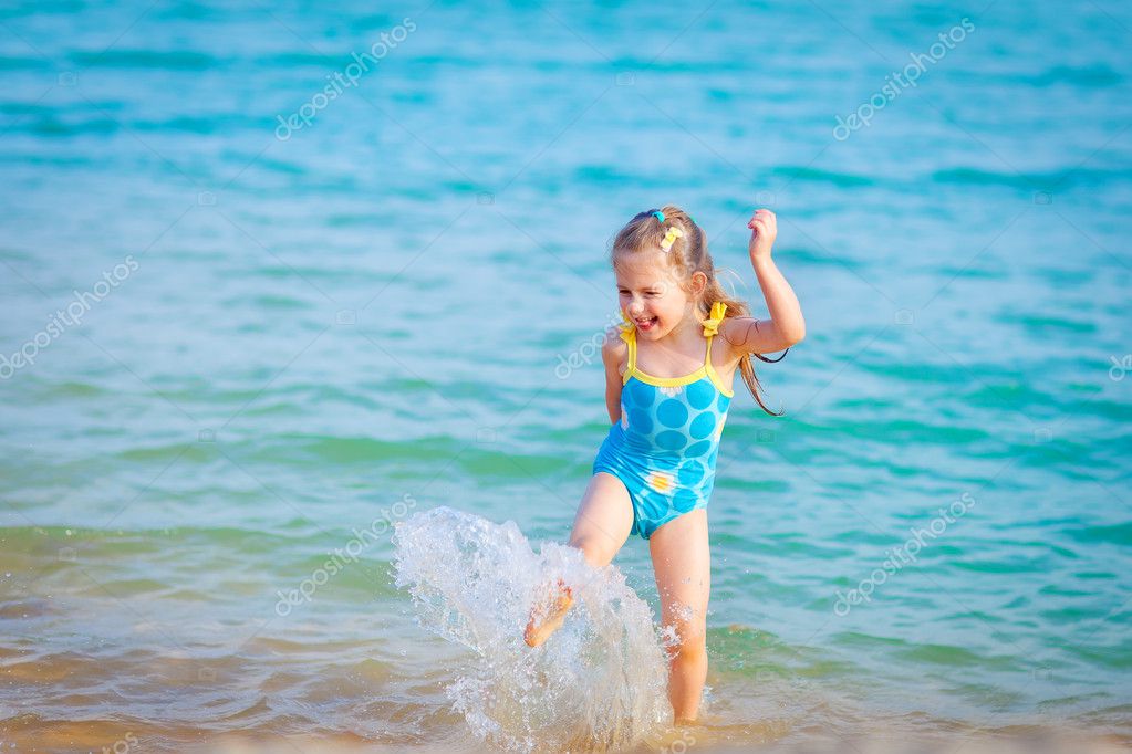 Happy girl in the sea. Fun with water drops Stock Photo by ©witch999 ...