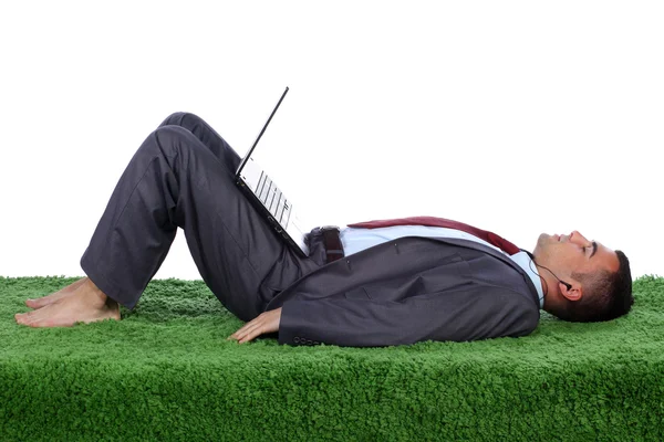 Young business man on a carpet — Stock Photo, Image