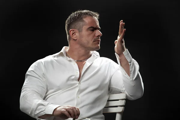 Muscular male in a white shirt — Stock Photo, Image