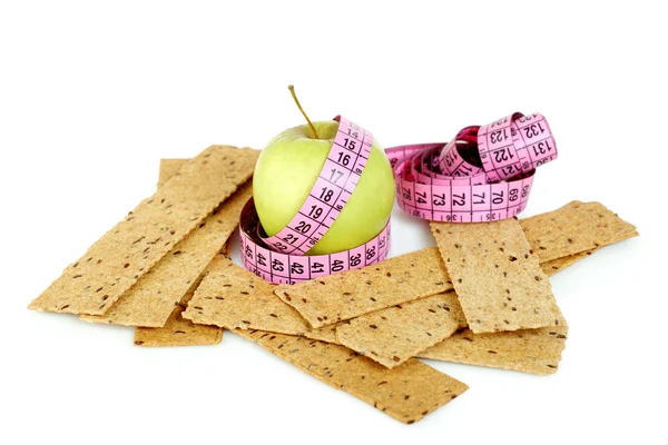Pink tailoring meter and biscuits — Stock Photo, Image