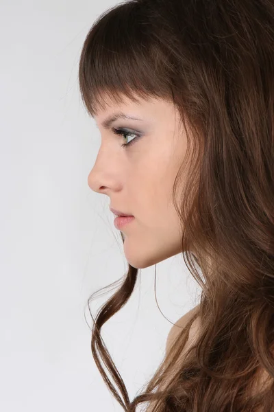 Ansikte av en flicka med långt hår — Stockfoto