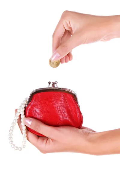 Red wallet and coin in womans hand — Stock Photo, Image