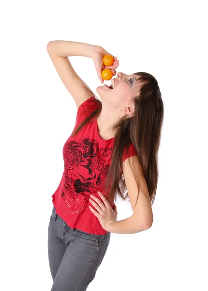 Lachende meisje met mandarijnen — Stockfoto