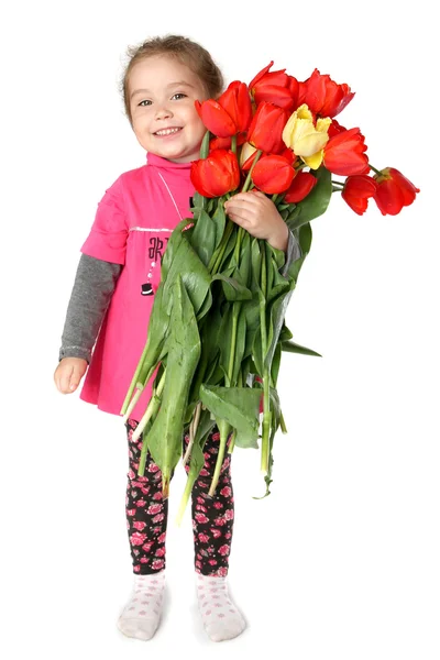 Little girl with a huge bouquet of tulips — Stock Photo, Image