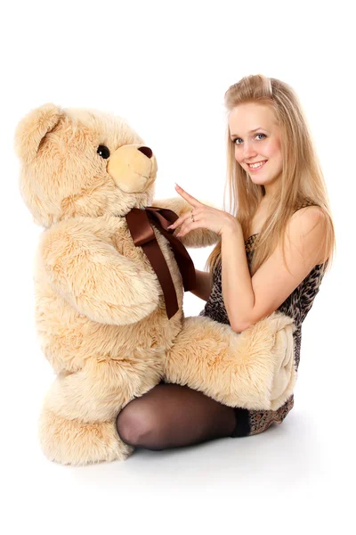 stock image Girl plays with stuffed bear