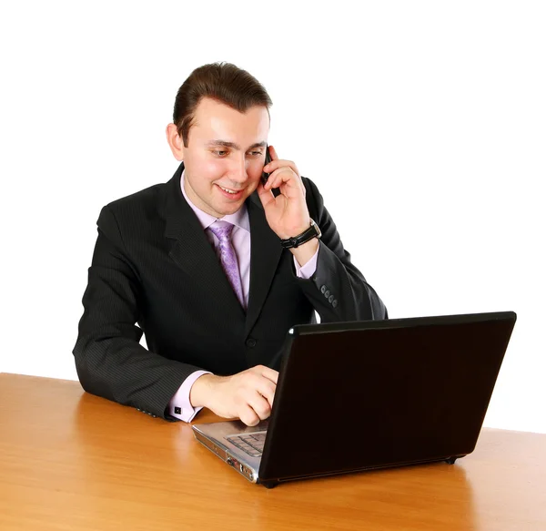 Homme d'affaires avec ordinateur portable et téléphone portable — Photo