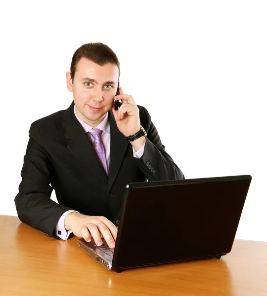 Biznesmen z laptopa i telefon komórkowy — Zdjęcie stockowe
