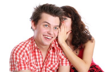 A girl whispers in the guy's ear clipart