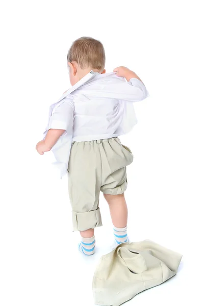 Small child quickly undresses — Stock Photo, Image