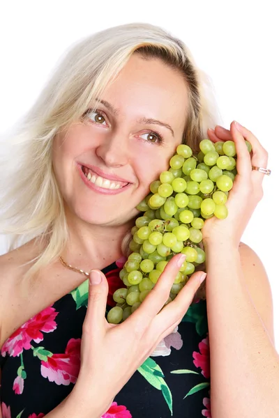 Vrouw met druiven lacht — Stockfoto