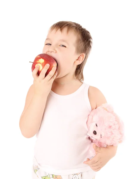 Criança jovem comendo uma maçã — Fotografia de Stock