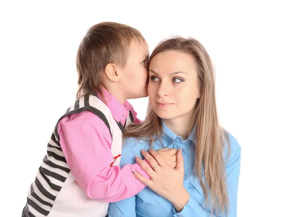 Criança diz a orelha de sua mãe — Fotografia de Stock