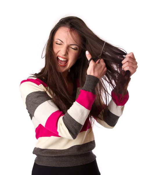 Woman is combing her hair — Stock Photo, Image