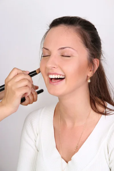 Make-up artists apply makeup model — Stock Photo, Image
