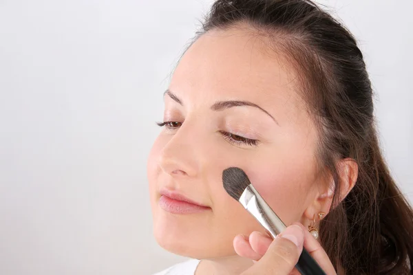 Make-up artists apply makeup model — Stock Photo, Image