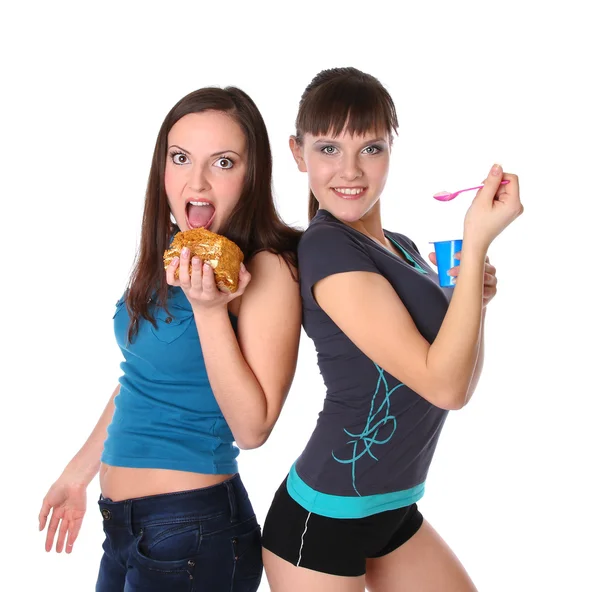 La grasa y las chicas delgadas está comiendo — Foto de Stock