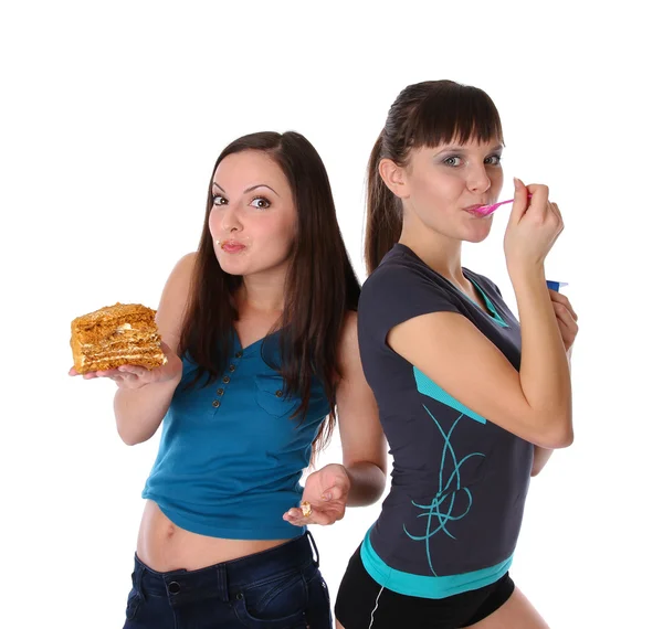Tlustá a tenká dívek eatting — Stock fotografie