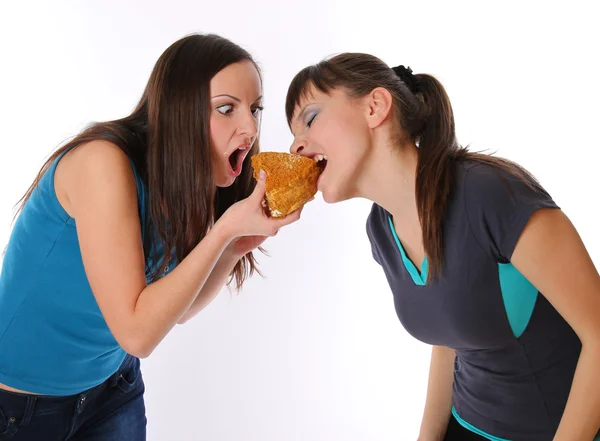 Tlustá a tenká dívek eatting — Stock fotografie