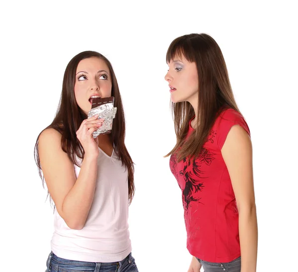 Två flickor med choklad — Stockfoto