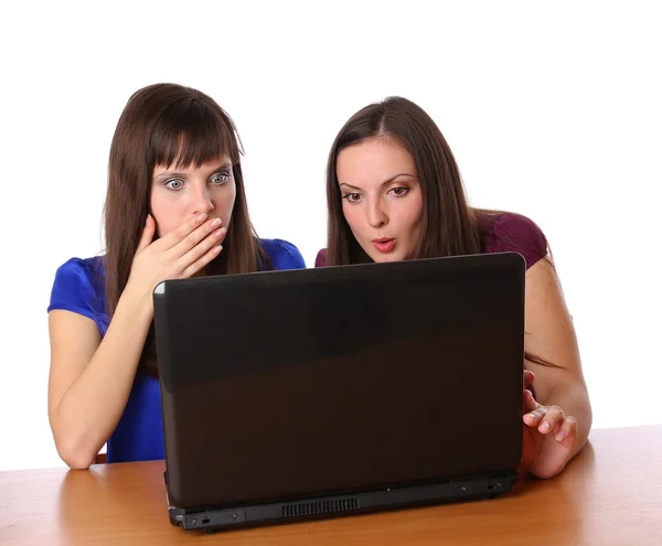 stock image Two girlfriends looking at laptop