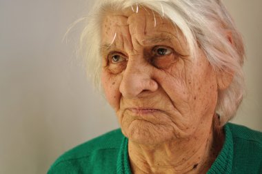 Close-up of the face of an old woman clipart