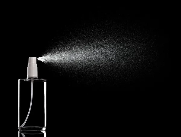 Botella de aerosol gota de perfume líquido —  Fotos de Stock