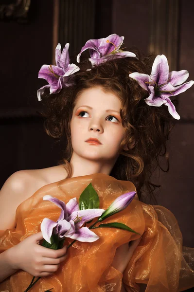 Girl with lilac lilies in her hair — Stock Photo, Image