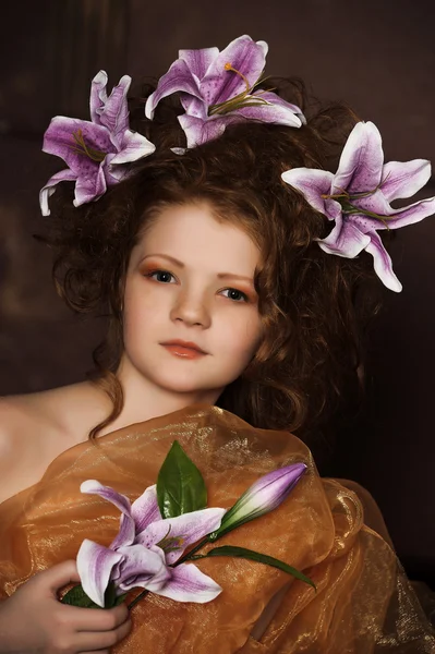 Girl with lilac lilies in her hair — Stock Photo, Image