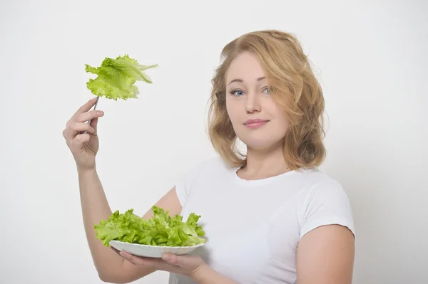 Hojas de ensalada y chica — Foto de Stock