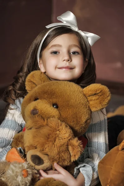 Girl with a teddy bear — Stock Photo, Image