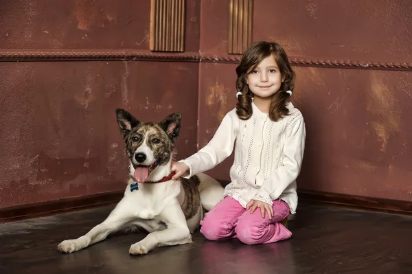 Vintage portrait of a little girl with dog — Stock Photo, Image