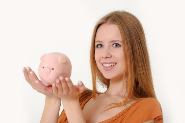 Kumbara ve parayla güzel kadın — Stok fotoğraf