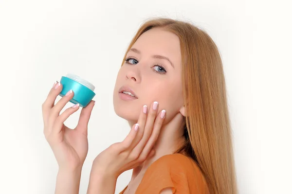 Woman holding moisturizing facial cream — Stock Photo, Image