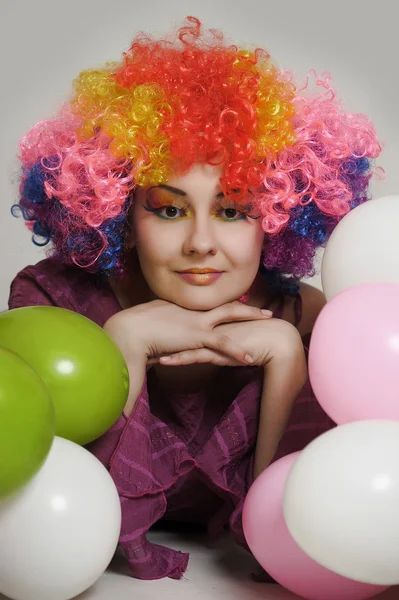 Girl clown and balloons — Stock Photo, Image