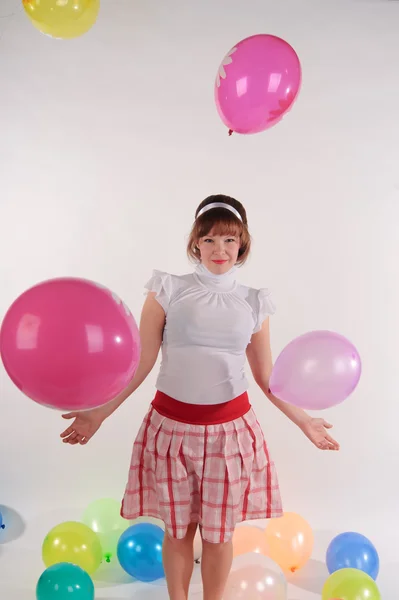 Schattig jong meisje met ballonnen — Stockfoto
