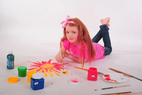 Girl brushes painting floor — Stock Photo, Image
