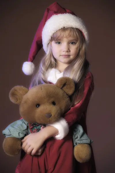 Enfant de Noël avec ours en peluche — Photo