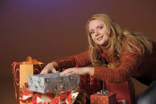 Young woman with a lot of present box — Stock Photo, Image