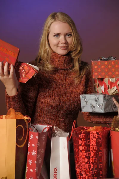 Beautiful woman gets a lot of gifts — Stock Photo, Image